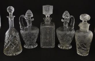A quantity of assorted cut glass decanters, claret jugs, etc. Largest approx. 11 1/4" high (5)