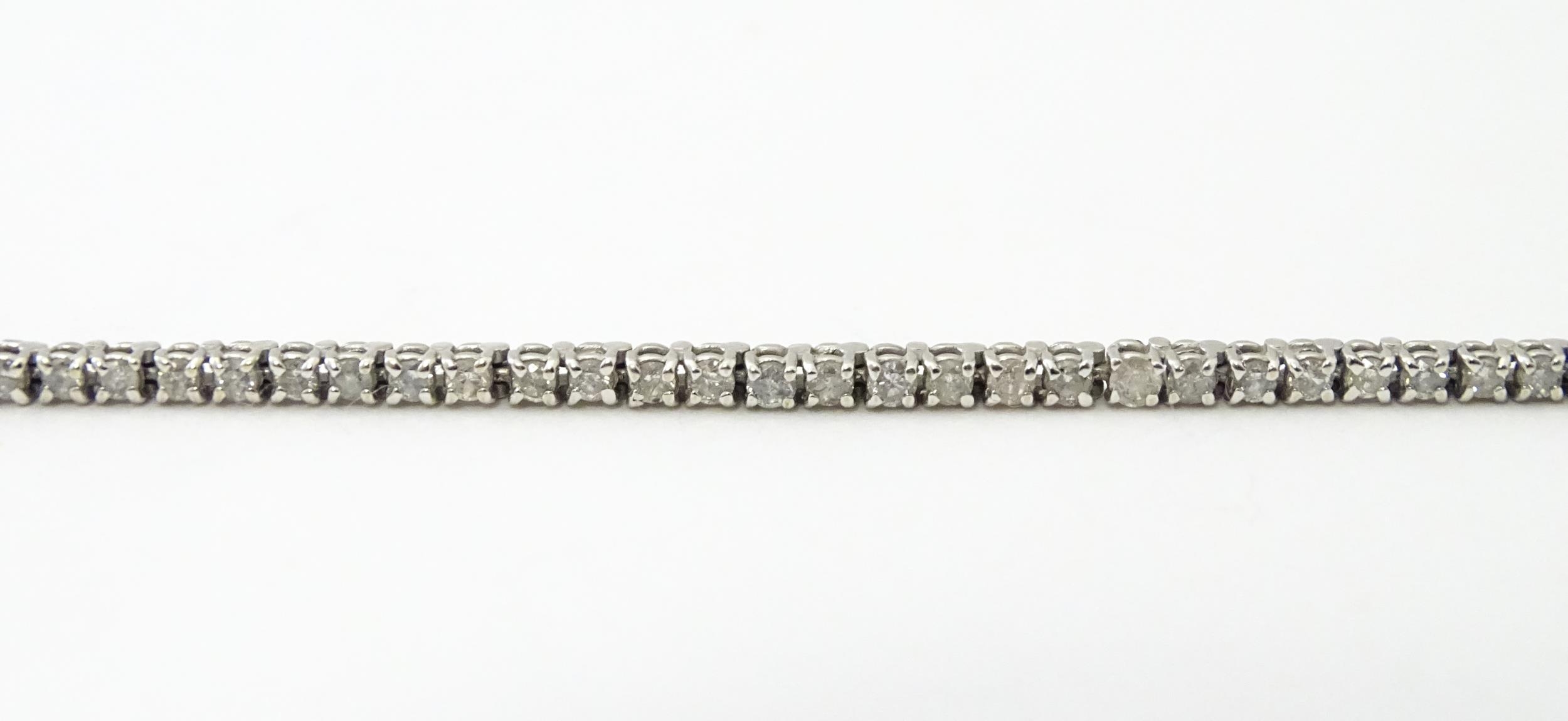 A 14ct white gold tennis bracelet set with diamonds. Approx 7 1/2" long Please Note - we do not make - Image 2 of 10