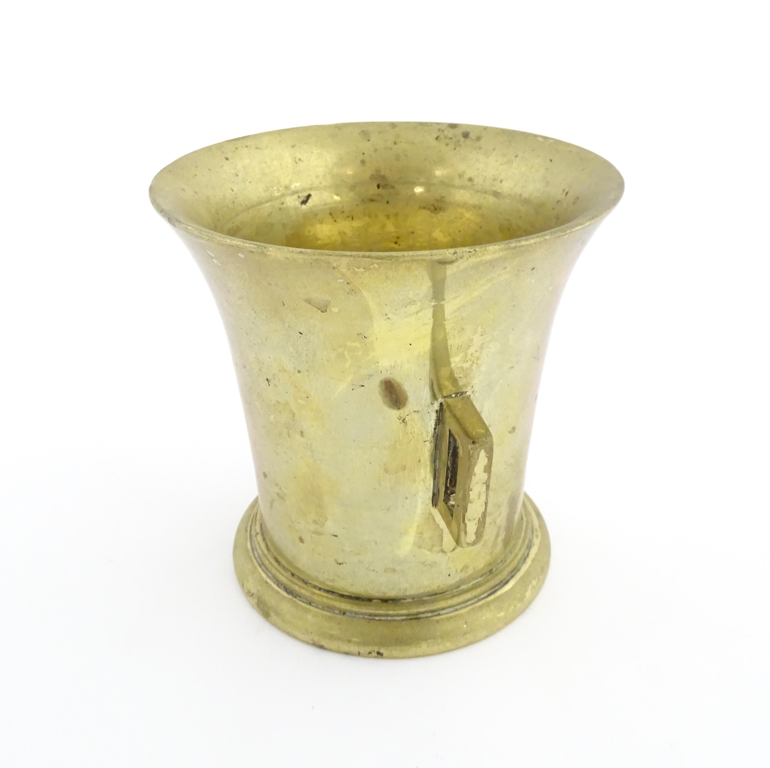 A 19thC brass pestle and mortar, the mortar of tapering form with twin rectangular handles. Mortar - Image 8 of 14