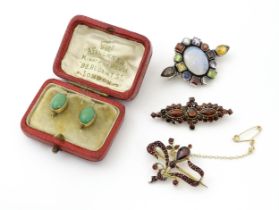 A pair of gold earrings set with green cabochon. Together with two yellow metal brooches set with