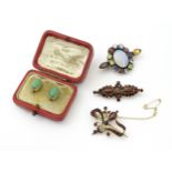 A pair of gold earrings set with green cabochon. Together with two yellow metal brooches set with