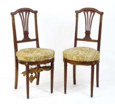 A pair of Louis Phillipe mahogany side chairs with pierced, fanned back splats over sprung seats and