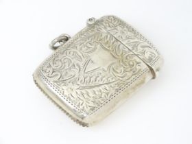 A silver vesta case with engraved decoration hallmarked 1920 George Randle. Approx 2" long (27g)