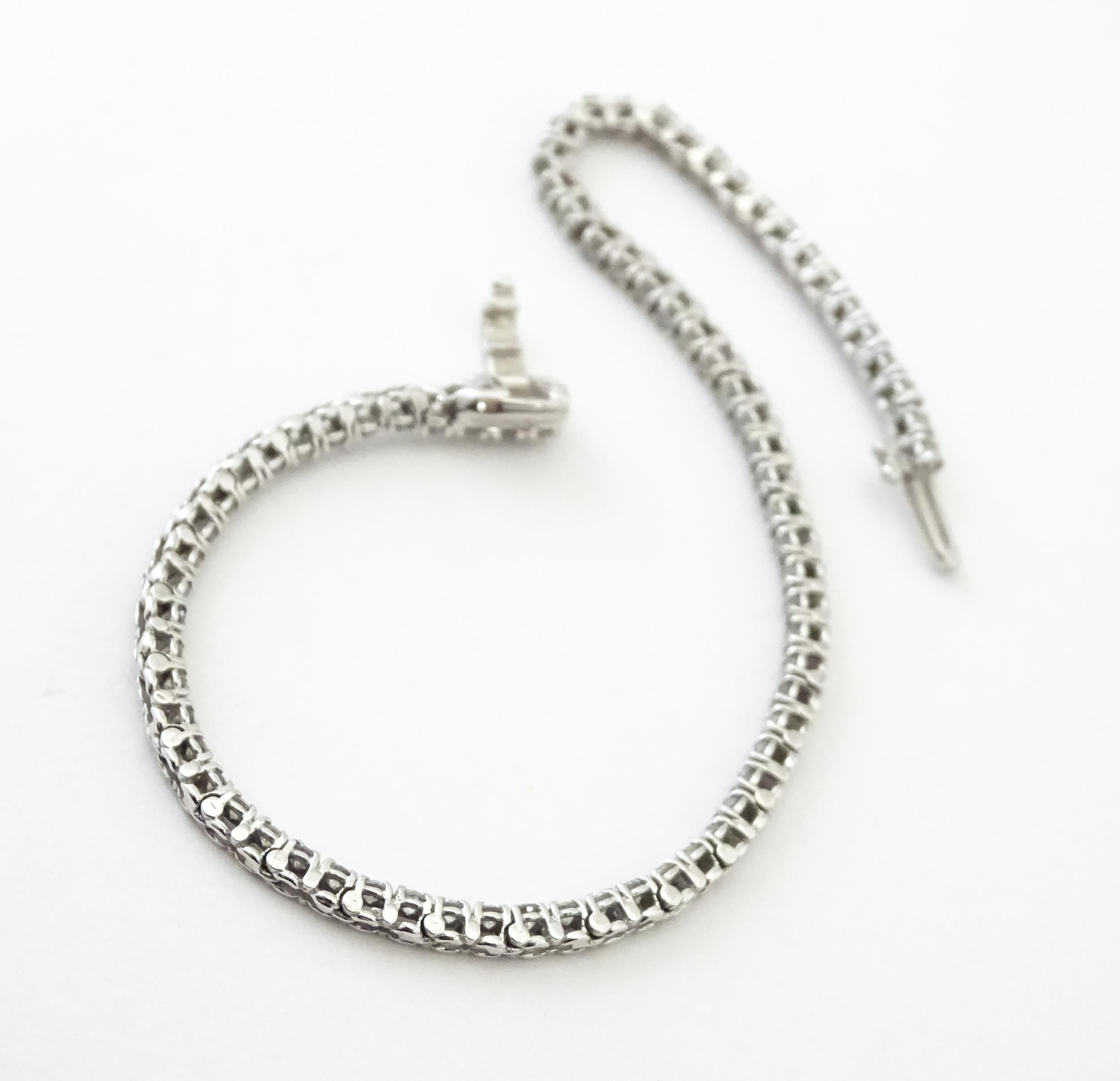 A 14ct white gold tennis bracelet set with diamonds. Approx 7 1/2" long Please Note - we do not make - Image 10 of 10