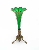 A Victorian epergne, the green glass flute with gilt highlights on a gilt metal triform base.