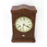 A mahogany cased mantle clock with silvered dial and Roman numerals. The by Gustav Becker 8-day