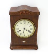 A mahogany cased mantle clock with silvered dial and Roman numerals. The by Gustav Becker 8-day