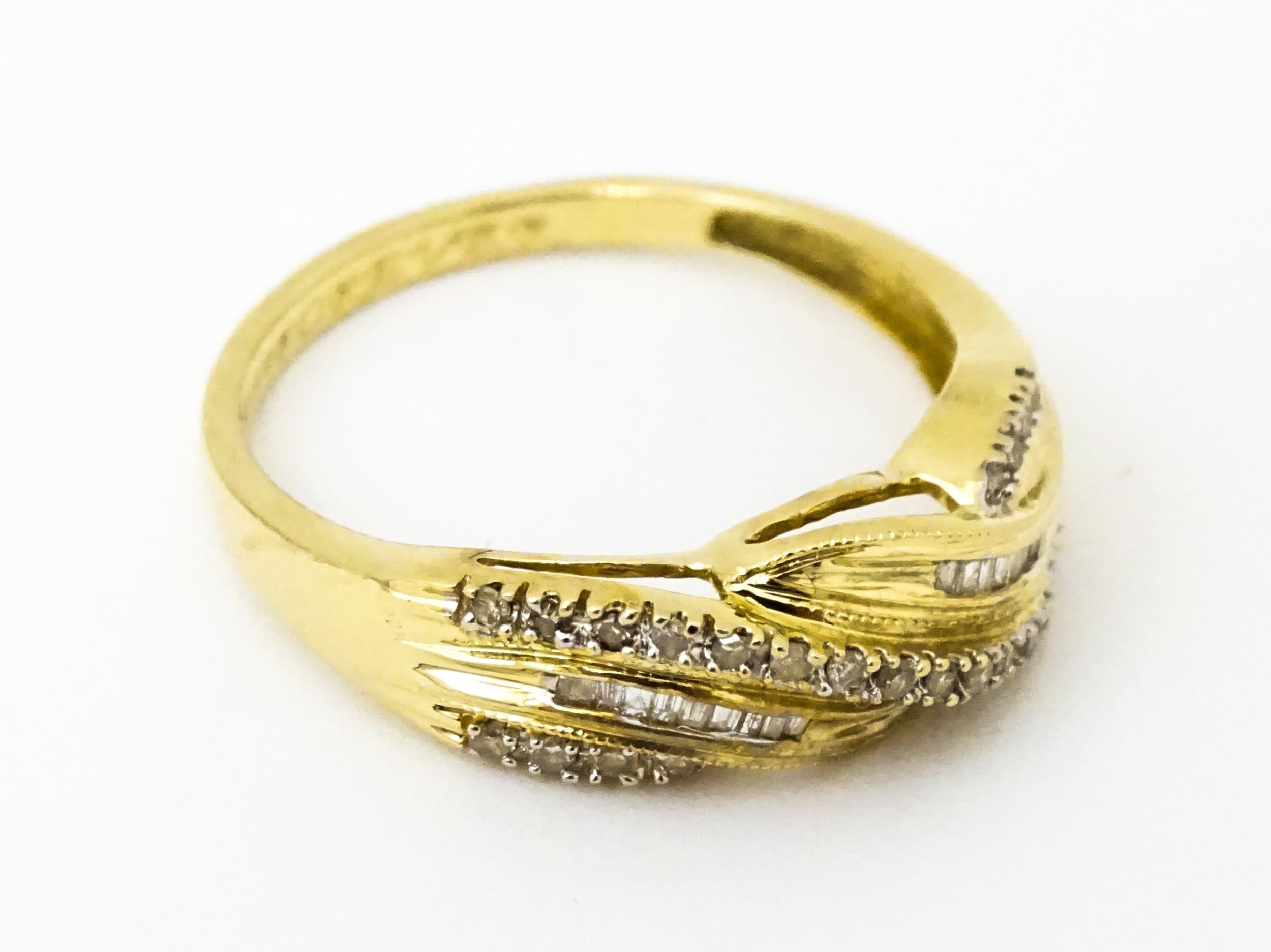 A 14ct gold with twist detail set with diamonds. Ring size approx. Q 1/2 Please Note - we do not - Image 3 of 7