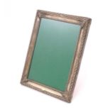 An easel back photograph frame with .800 Continental silver surround. Approx. 8 3/4" high overall