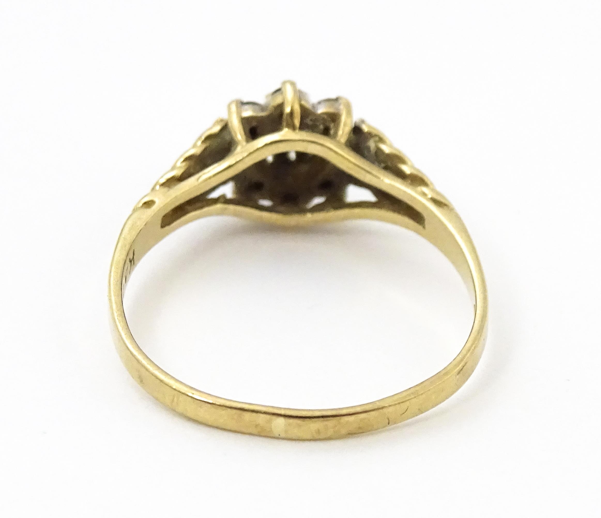 A 9ct gold ring set with central diamond bordered by sapphires. Ring size approx. M Please Note - we - Image 8 of 8