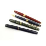 Three fountain pens, comprising a Conway Stewart '58' with green ribboned finish and 14kt gold