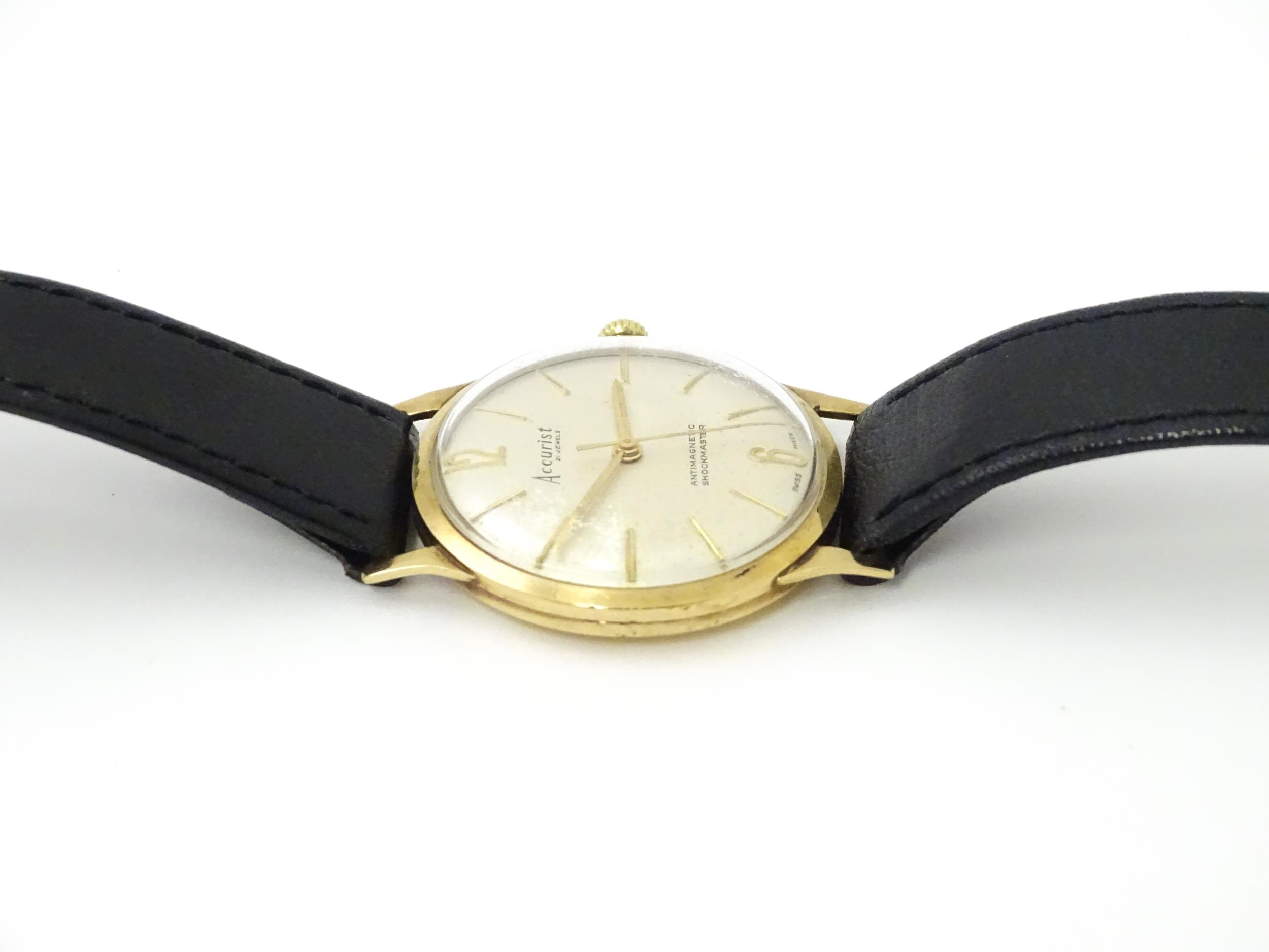 A Gentleman's 9ct gold cased Accurist wristwatch/ The watch approx 3 1/4" Please Note - we do not - Image 6 of 10