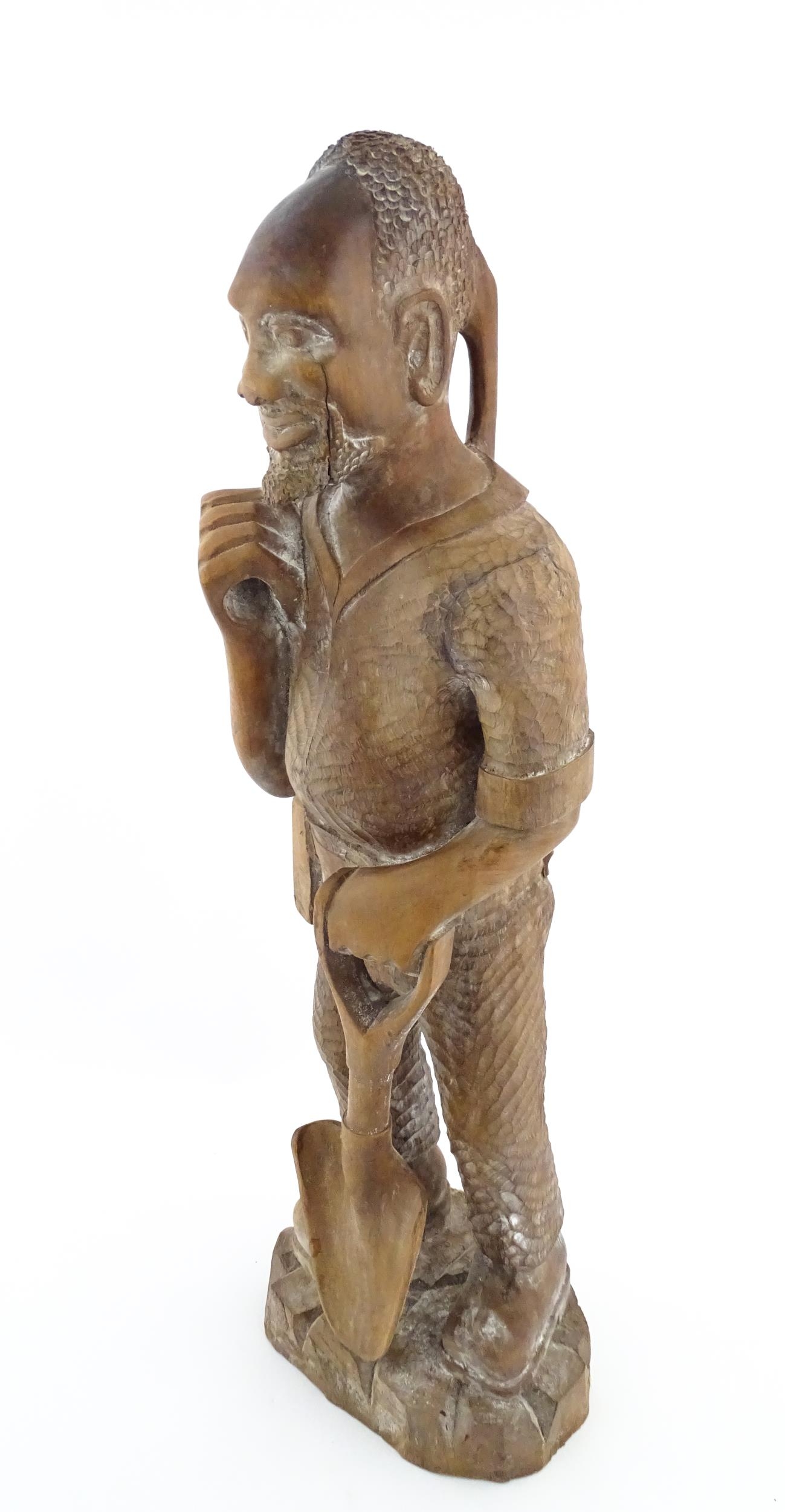 Ethnographic / Native / Tribal: An African carved wood figure modelled as a male farmer with a - Image 4 of 8