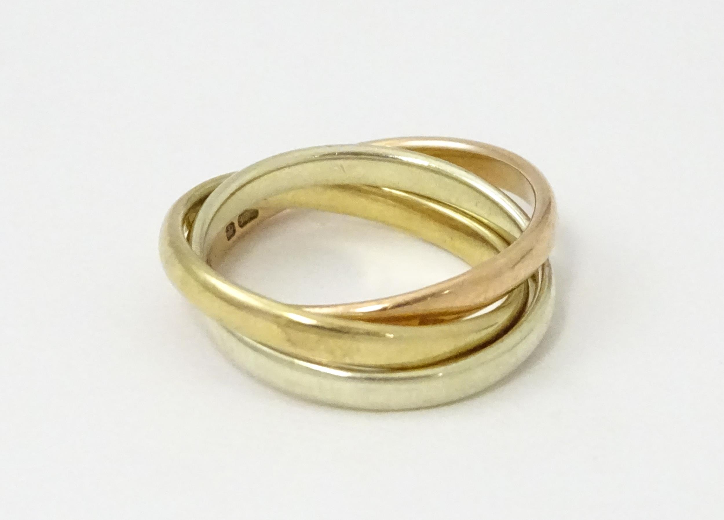 A 9ct tri-gold Russian wedding ring. Ring size approx. G 1/2 Please Note - we do not make