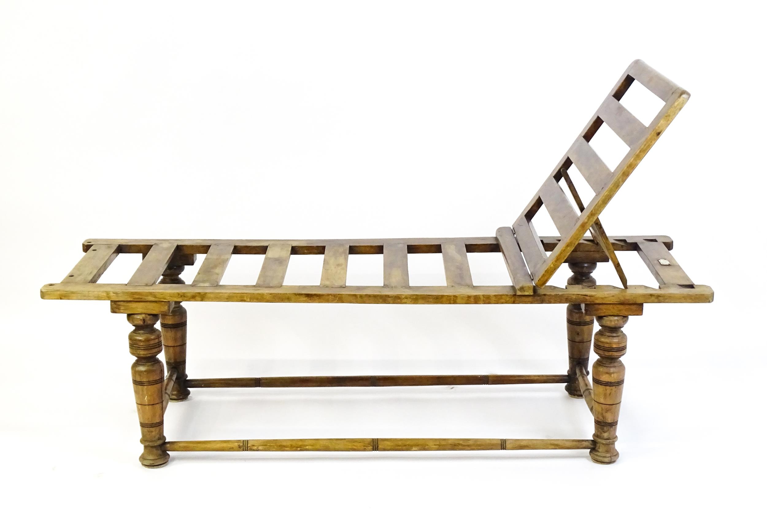 A late 19thC 'Leveson & Sons' campaign bed /day bed with a slatted bed and adjustable headrest above - Image 8 of 9
