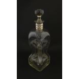 A Victorian glass decanter with pinch detail and silver collar hallmarked Sheffield 1887 maker