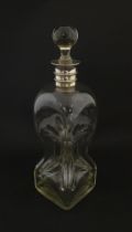 A Victorian glass decanter with pinch detail and silver collar hallmarked Sheffield 1887 maker