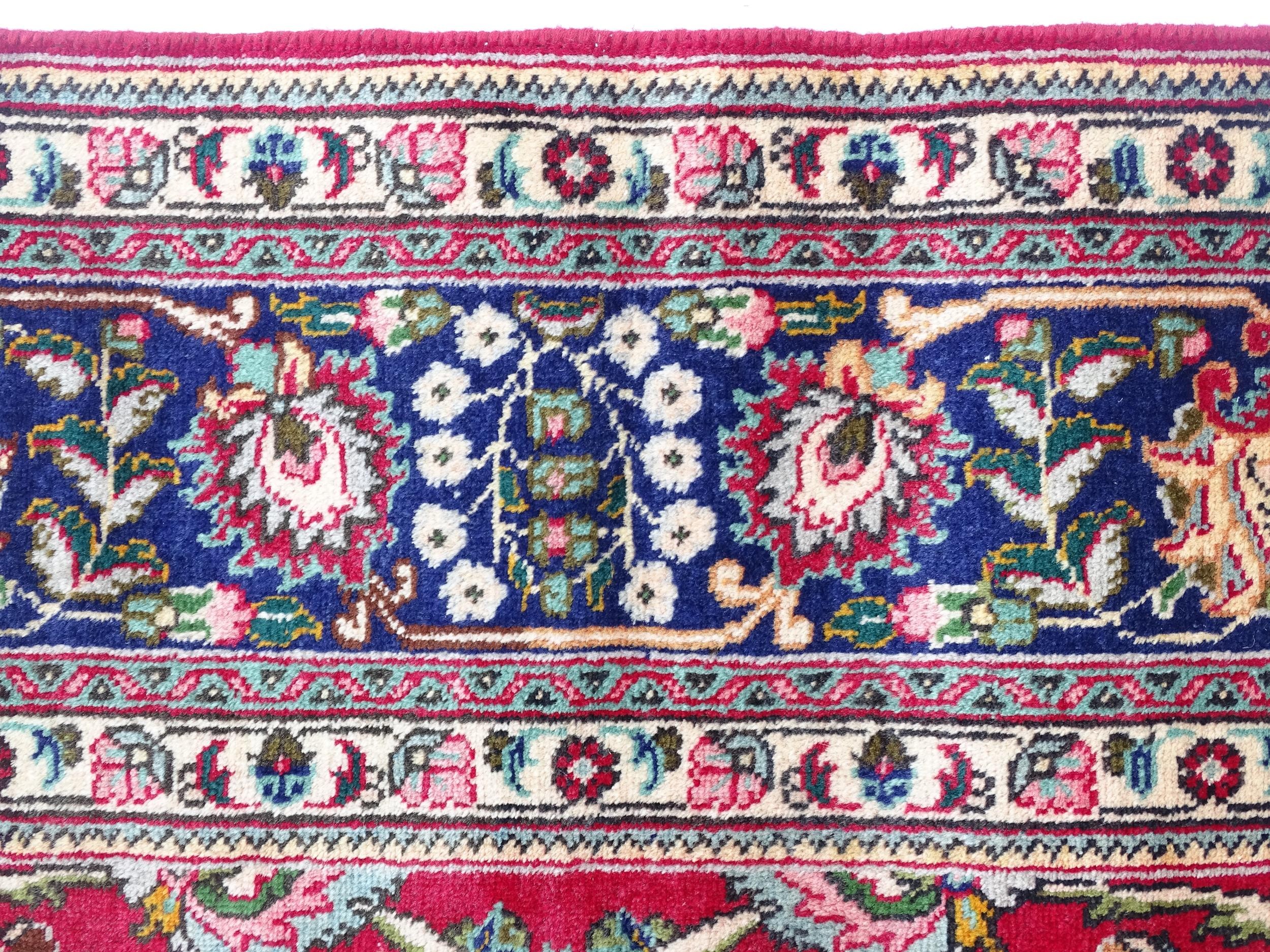 Carpet / Rug: A North West Persian Tabriz carpet the red ground with central cream and blue - Image 6 of 11