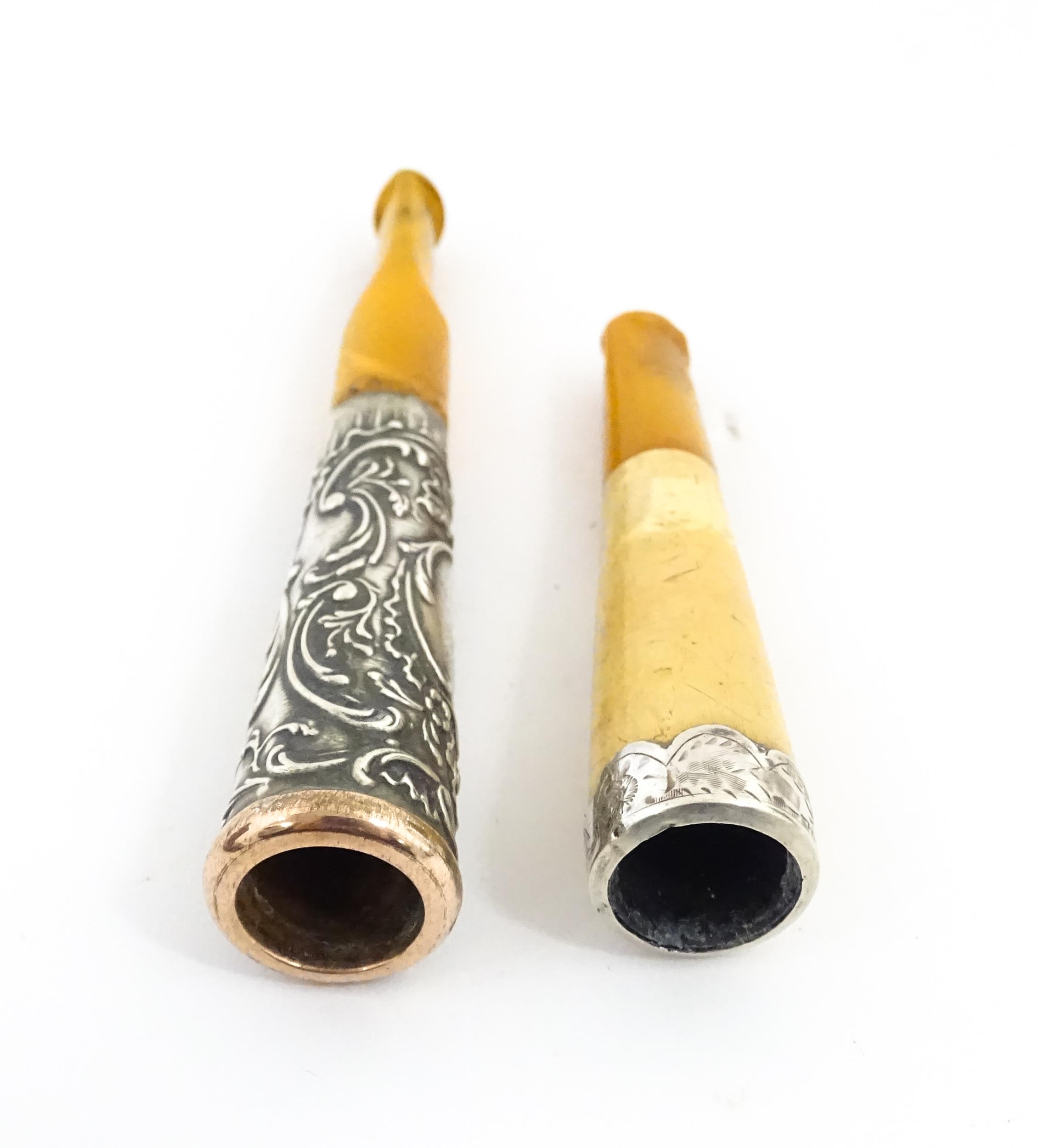 Two amber cheroot mouthpiece holders with white metal mounts, one with meerschaum detail. On - Image 6 of 8