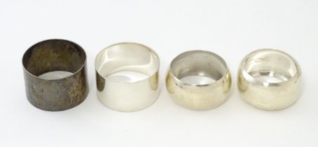 Four assorted silver napkin rings hallmarks to include Birmingham 1911, 1922, Sheffield 1942,