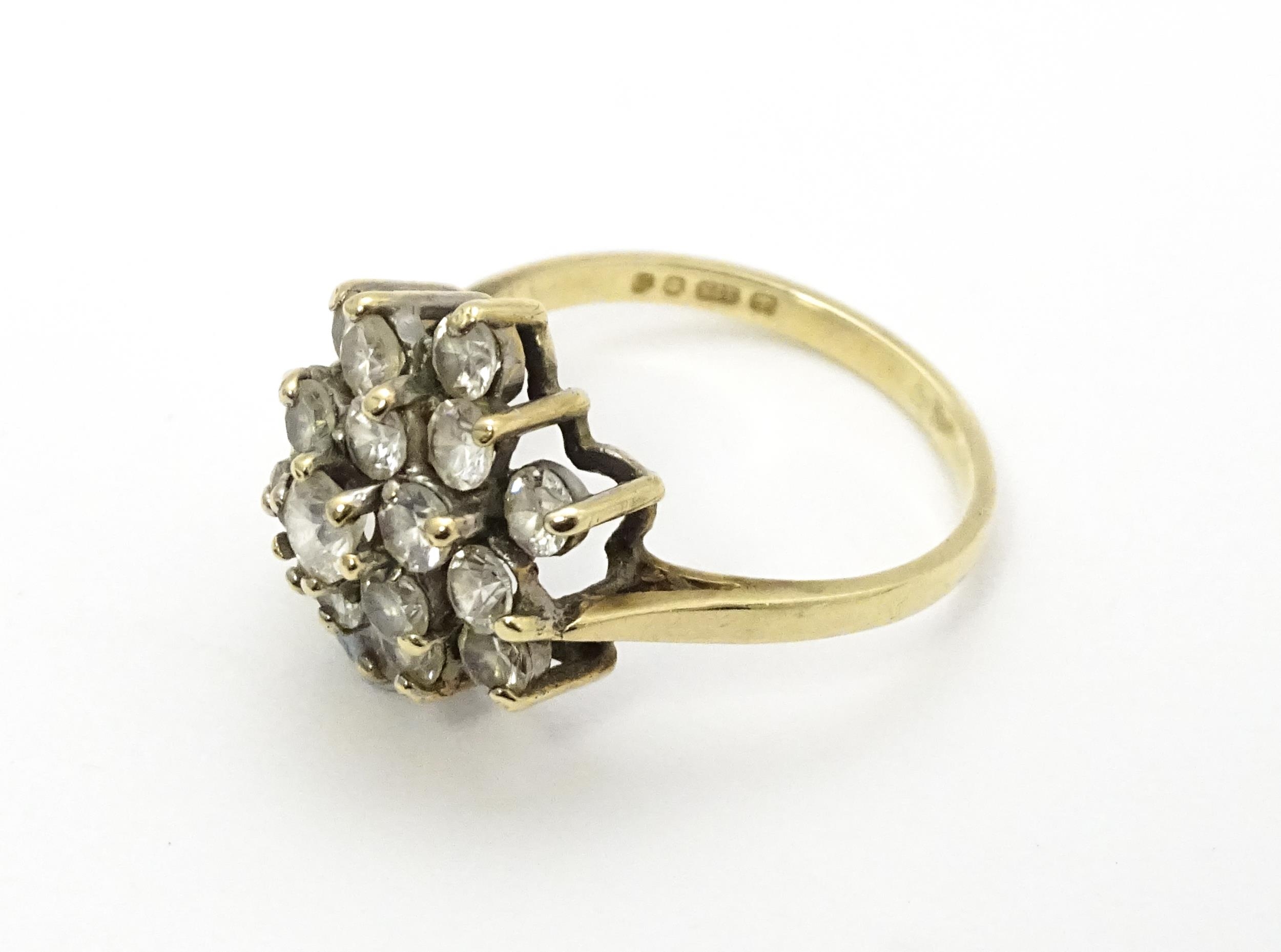 A 9ct gold ring set with diamonds in a floral cluster setting. Ring size approx. M Please Note - - Image 5 of 8