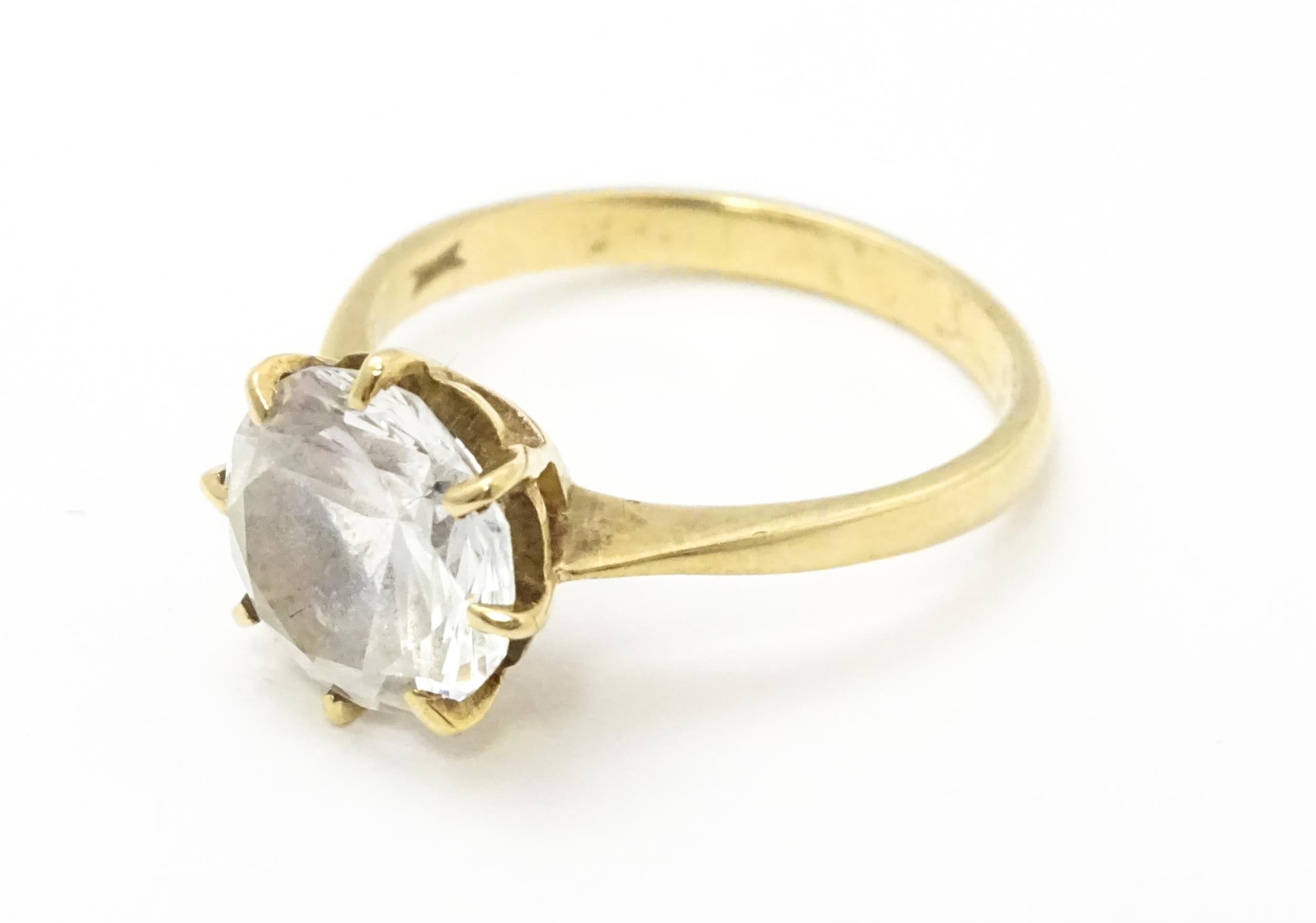 A 9ct gold ring set with a white stone solitaire. Ring size approx. O Please Note - we do not make - Image 3 of 7