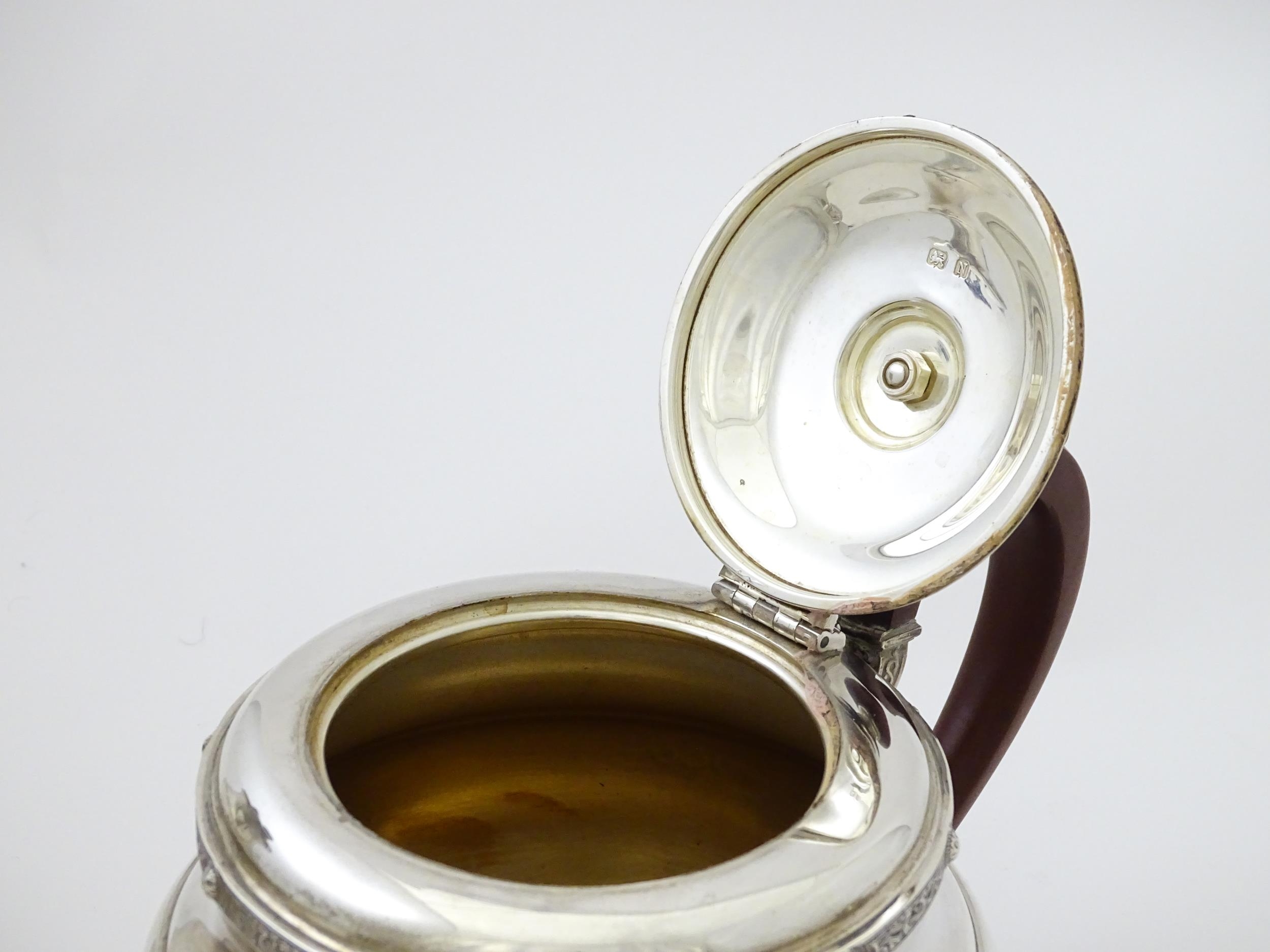 A three piece silver tea set comprising teapot, hot water pot and cream jug, with Celtic style - Image 6 of 20