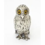 A Victorian silver novelty pepperette modelled as an owl with glass eyes, hallmarked London 1853,