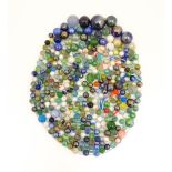 Toys: A quantity of glass marbles, many with colours twists, etc. Largest approx. 1 3/4" diameter