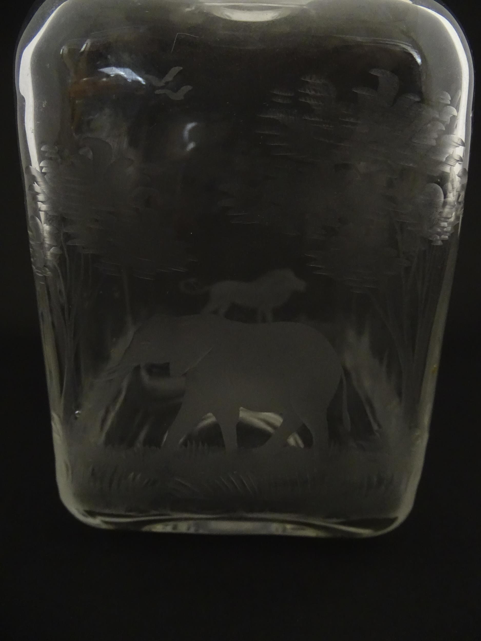 A Rowland Ward decanter glass with engraved Safari animal detail. Unsigned. Together with a similar - Image 8 of 11