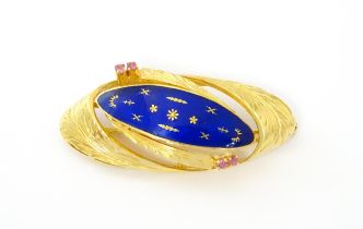 An 18ct gold brooch with blue enamel detail flanked by pink stones. Approx 2 wide Please Note - we