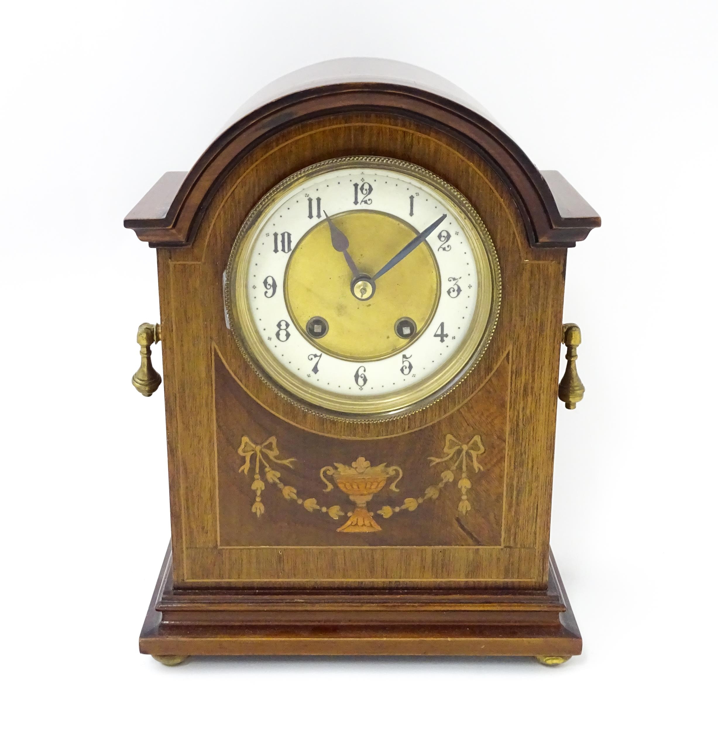 A late 19thC / early 20thC German mahogany cased mantel clock by Philipp Haas & Sohne. The case with