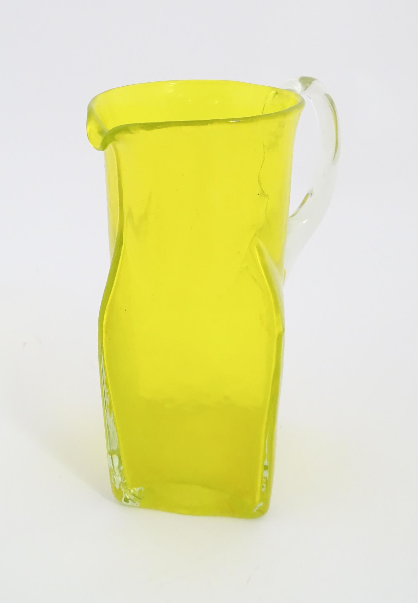 A 20thC yellow glass jug with squared base and clear glass handle. Approx. 8 1/2" high Please Note - - Image 8 of 11