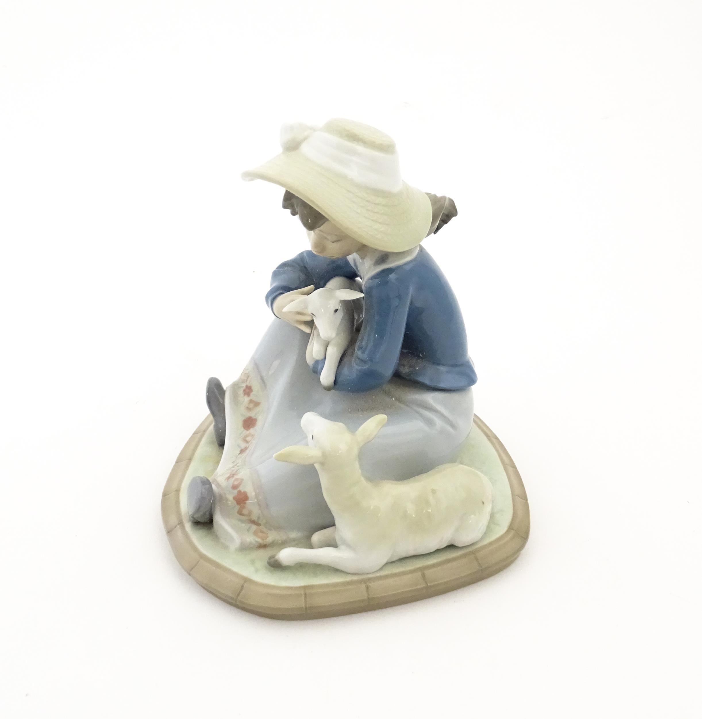 A Lladro model Lambkins, model no. 5469. Marked under. With box. Approx. 5 3/4" high Please Note - - Image 6 of 8