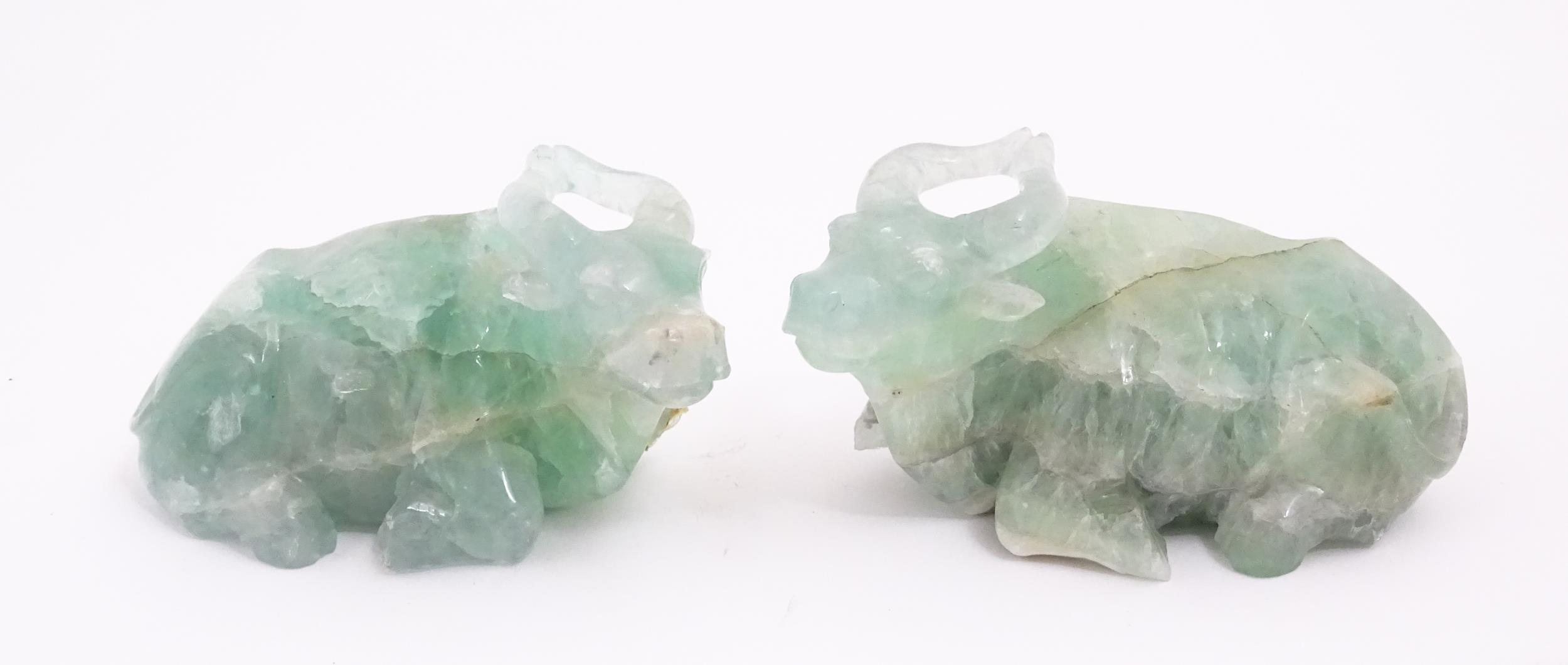 Two Chinese carved green fluorite models of recumbent buffalo, on wooden stands. Approx. 5" wide (2) - Image 2 of 7