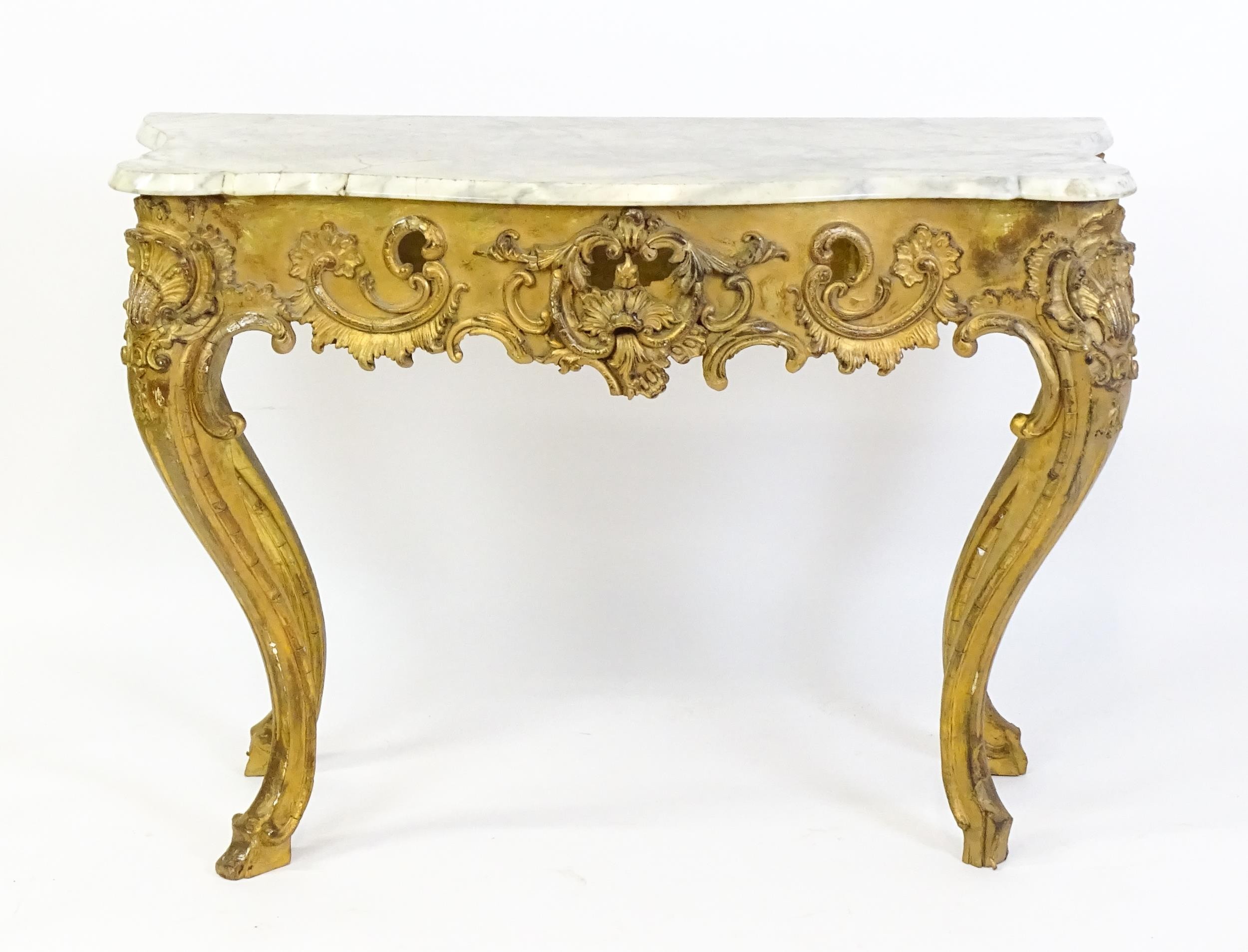 A 19thC marble topped table with a gesso and giltwood moulded base, decorated with shells, - Image 4 of 8