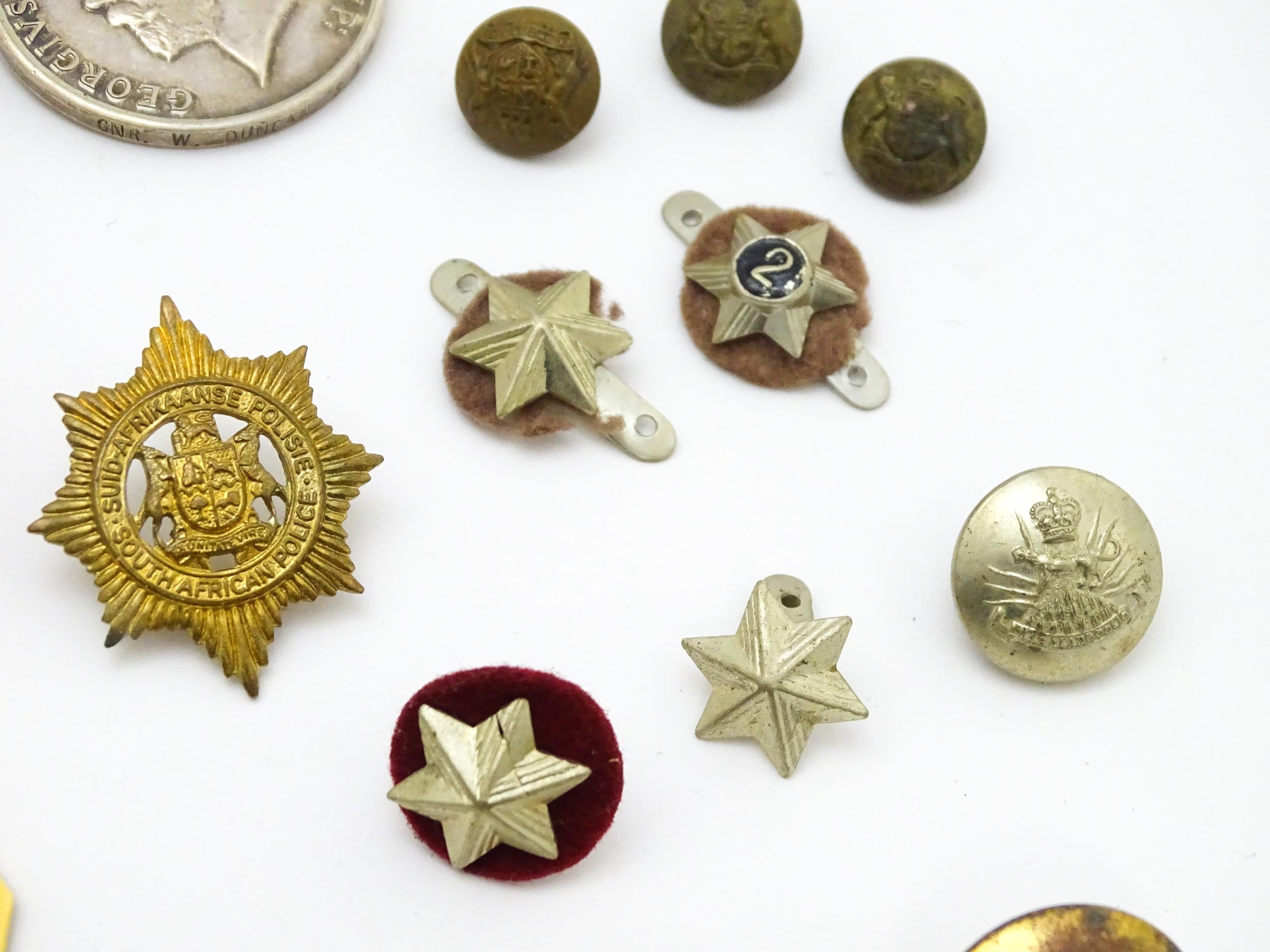 Militaria : a quantity of 20thC medals and insignia, comprising two WWI campaign medals to Gnr. W. - Image 11 of 16