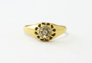 An 18ct gold ring set with 6 diamonds. Ring size approx L Please Note - we do not make reference