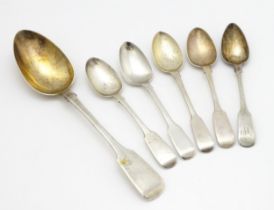 Five assorted 19thC silver Fiddle pattern teaspoons. Together with a table spoon hallmarked London