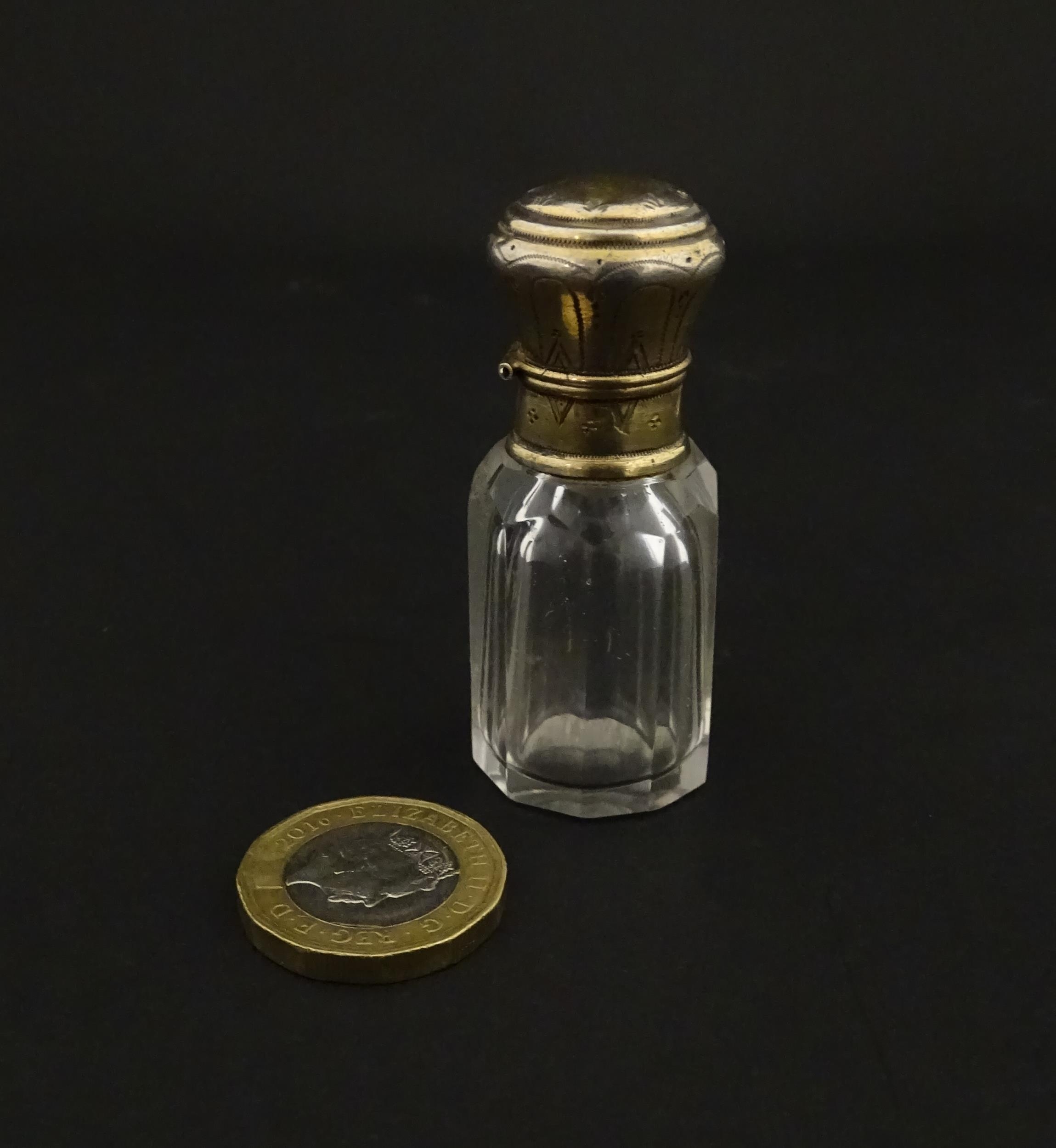 A French scent / perfume bottle with silver gilt top. Approx. 2 1/4" high Please Note - we do not - Image 4 of 10
