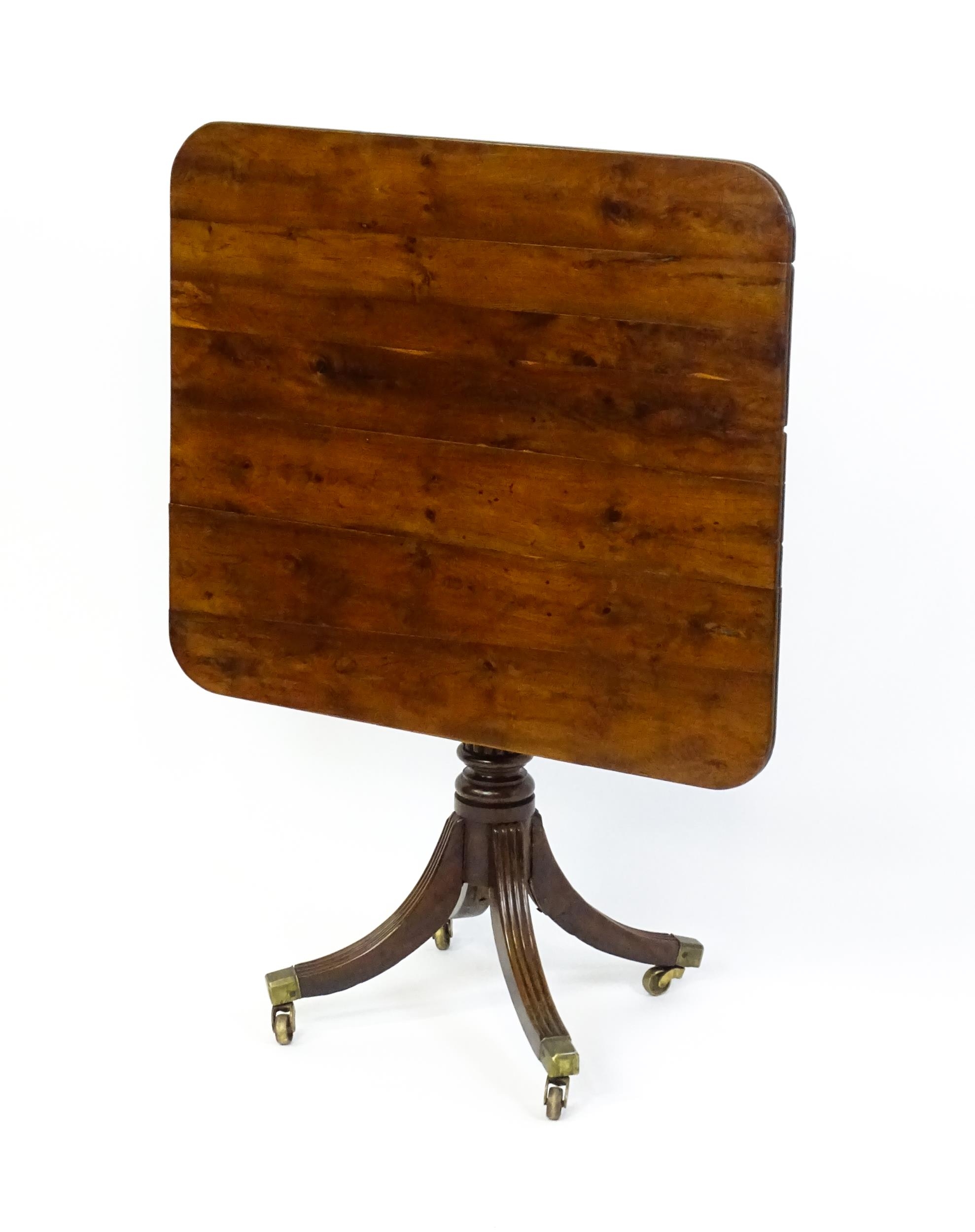 A 19thC tilt top occasional table with yew wood planked top above a reeded mahogany pedestal and - Image 9 of 13