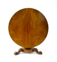 A 19thC mahogany tilt top breakfast table with a carved frieze above a turned and carved pedestal