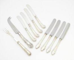 Assorted silver handled tea knives to include pistol grip examples. Together with a silver handled
