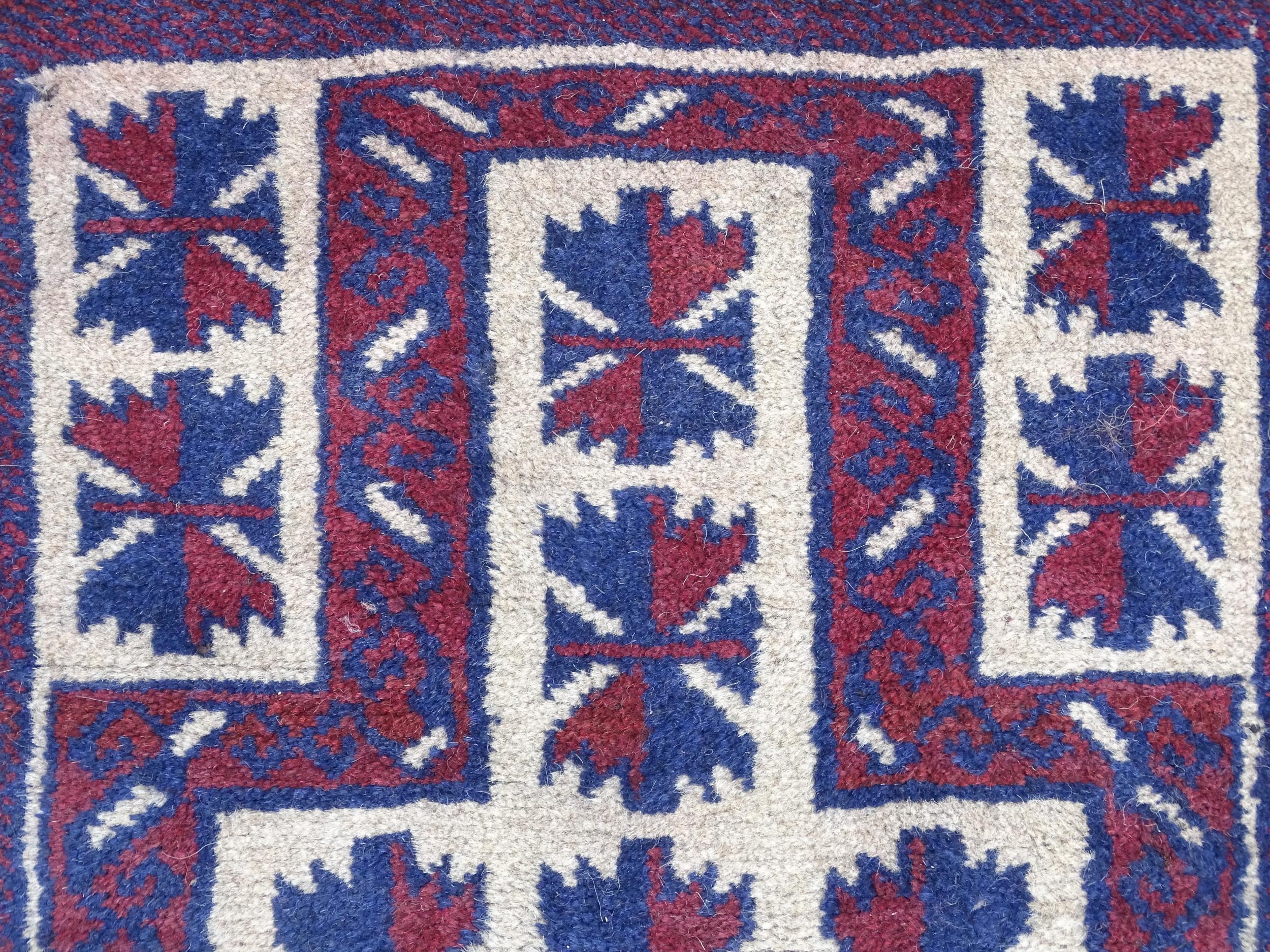 Carpet / Rug : A red, blue and cream ground rug with repeating geometric motifs. Approx. 55" x 29" - Image 4 of 7