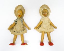 Toys: Two vintage Continental wooden peg dolls with painted features. Approx. 7 1/4" high (2) Please