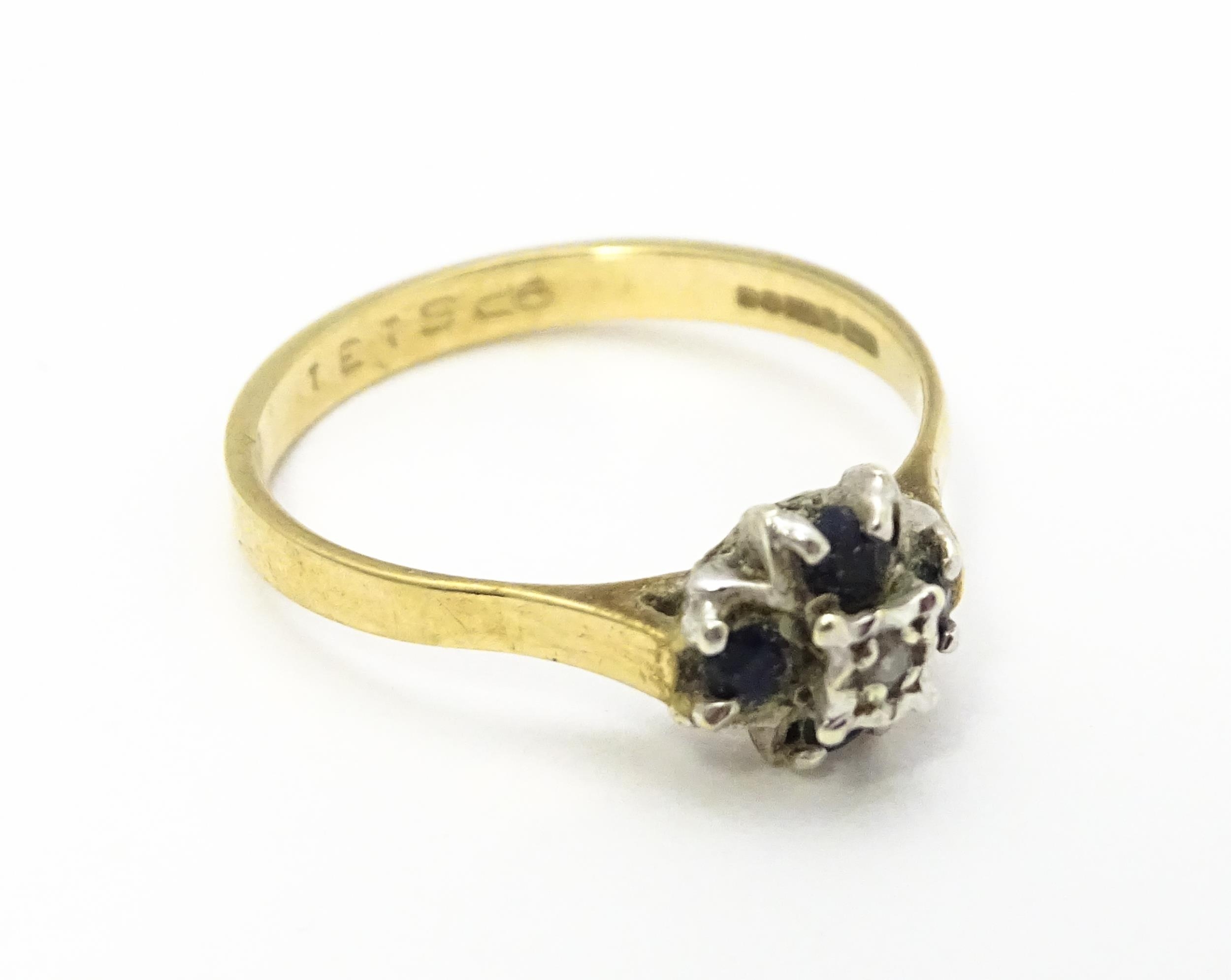 A 9ct gold ring set with diamonds and blue stones. Ring size approx. L Please Note - we do not - Image 4 of 7