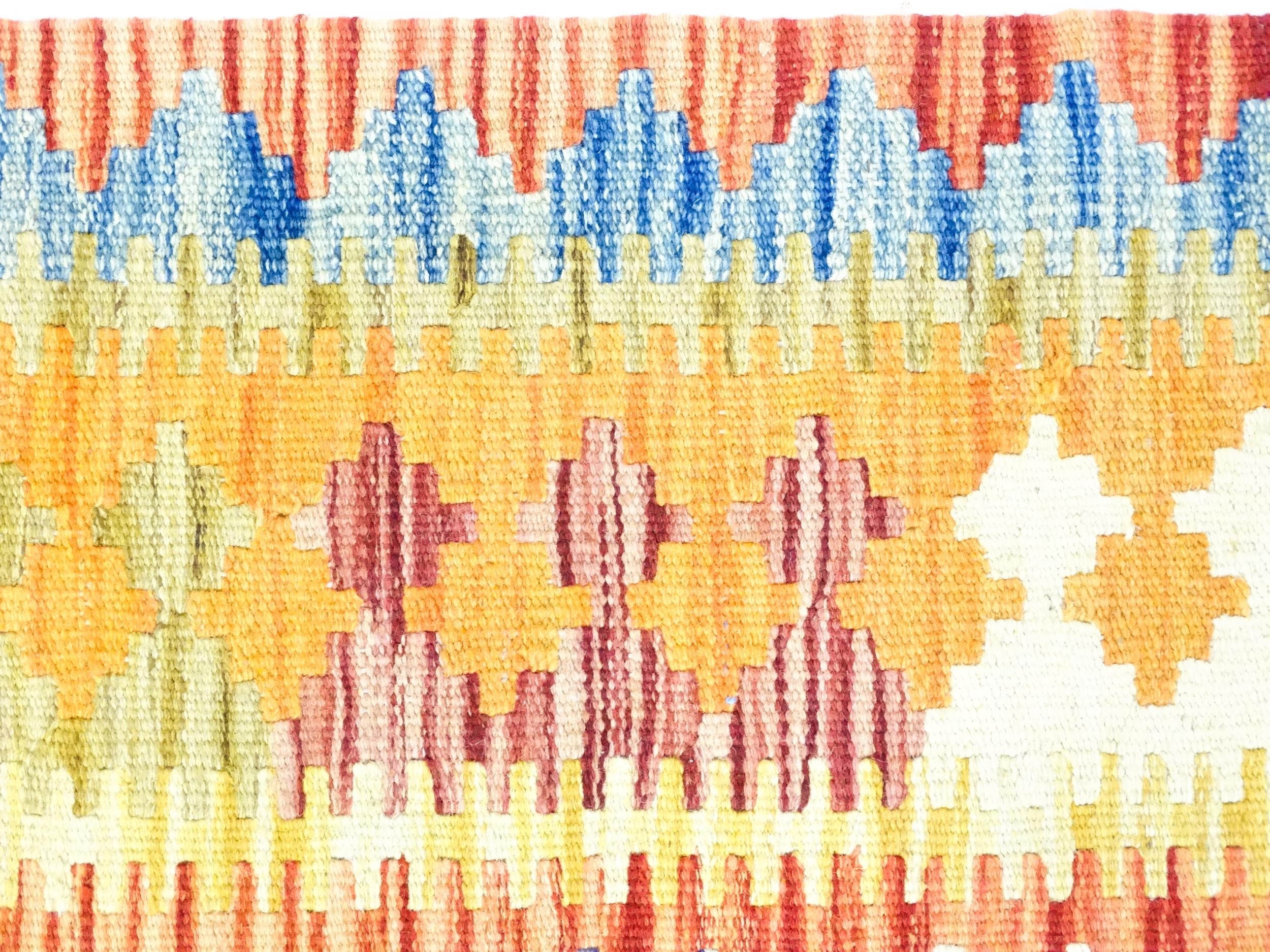 Carpet / Rug : A Turkish Anatolian kilim rug with repeating geometric motifs. Approx. 72" x 48" - Image 4 of 7