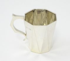 An Art Deco silver Christening mug hallmarked Birmingham 1931, maker S Blanckensee & Son Ltd.