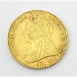 Coin : A Victoria 1900 gold sovereign. (8g) Please Note - we do not make reference to the
