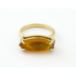 A 9ct gold ring with fire opal approx 3/4" long. Ring size approx. M Please Note - we do not make